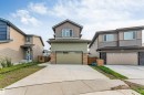 Contemporary exterior featuring multi-toned siding and stone veneer accents - 329 Balsam Link, Leduc, AB  - Outdoor With Facade 