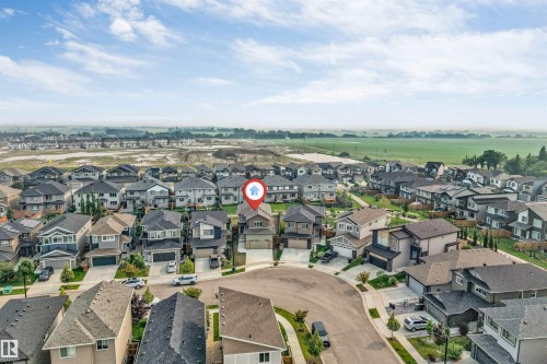 Residential development on a cul-de-sac with a green field horizon - 329 Balsam Link, Leduc, AB - Outdoor With View