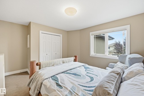 Neutral-toned walls with carpeted flooring - 2416 Warry Place Sw, Edmonton, AB - Indoor Photo Showing Bedroom