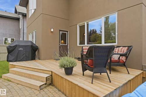 Exterior stucco finish with multiple windows - 2416 Warry Place Sw, Edmonton, AB - Outdoor With Deck Patio Veranda With Exterior