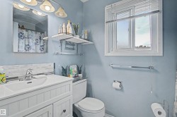 White vanity with beadboard paneling, integrated sink, and chrome-finish faucet - 