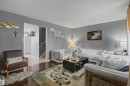Wood-finish flooring with a decorative area rug - 5724 143 Avenue Nw, Edmonton, AB 