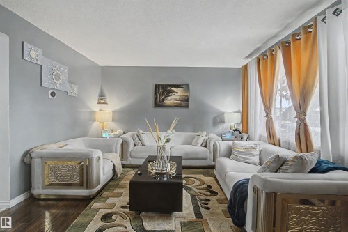 Recessed lighting and a white ceiling complement the light gray wall paint - 5724 143 Avenue Nw, Edmonton, AB - Indoor Photo Showing Living Room