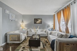 Recessed lighting and a white ceiling complement the light gray wall paint - 
