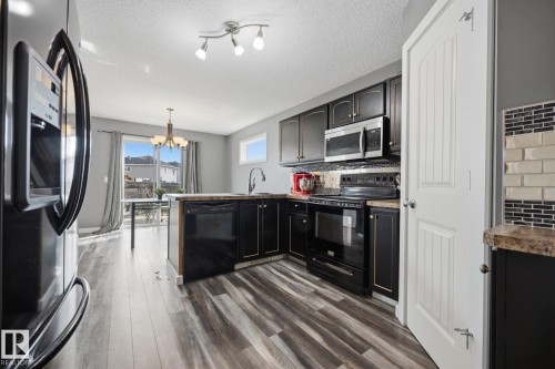 73 Dalquist Bay, Leduc, AB - Indoor Photo Showing Kitchen With Upgraded Kitchen