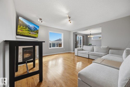 73 Dalquist Bay, Leduc, AB - Indoor Photo Showing Living Room With Fireplace