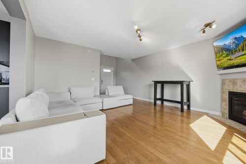 73 Dalquist Bay, Leduc, AB - Indoor Photo Showing Living Room With Fireplace