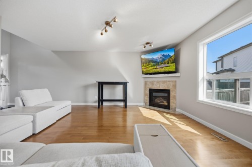 73 Dalquist Bay, Leduc, AB - Indoor Photo Showing Living Room With Fireplace