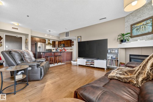 #115 35 Sturgeon Rd, St. Albert, AB - Indoor Photo Showing Living Room With Fireplace