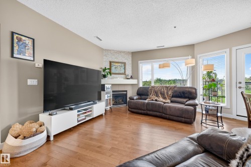 #115 35 Sturgeon Rd, St. Albert, AB - Indoor Photo Showing Living Room With Fireplace