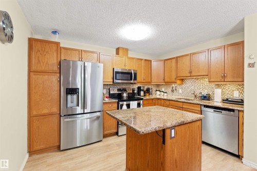 #218 2098 Blackmud Creek Dr Sw, Edmonton, AB - Indoor Photo Showing Kitchen With Stainless Steel Kitchen