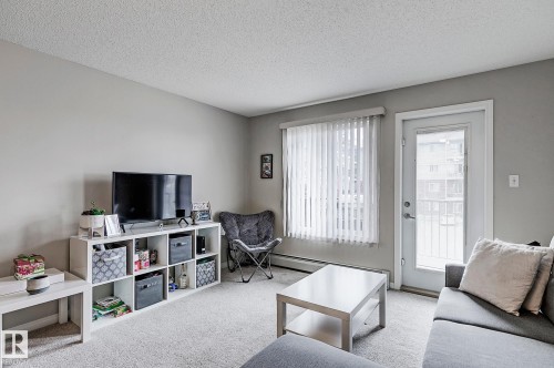 #203 111 Edwards Dr Sw, Edmonton, AB - Indoor Photo Showing Living Room