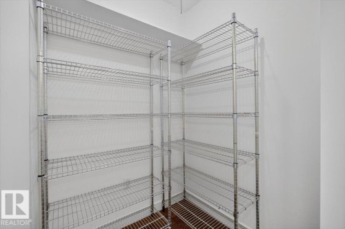 Chrome wire shelving system with multiple adjustable shelves - #506 12121 Jasper Av Nw, Edmonton, AB - Indoor With Storage