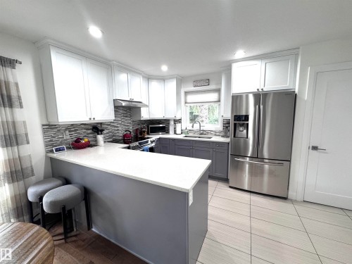 7004 97 Street Nw, Edmonton, AB - Indoor Photo Showing Kitchen With Stainless Steel Kitchen