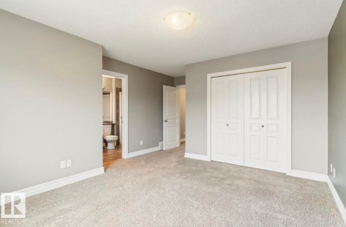 Wall-to-wall carpeting, light gray wall paint, and white trim throughout - 79 Catalina Crest, Fort Saskatchewan, AB - Indoor