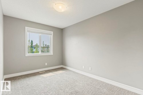 Neutral-toned walls with a single window, overhead lighting, and carpeted flooring - 79 Catalina Crest, Fort Saskatchewan, AB - Indoor Photo Showing Other Room