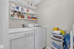 White wall-mounted shelving above appliances - 