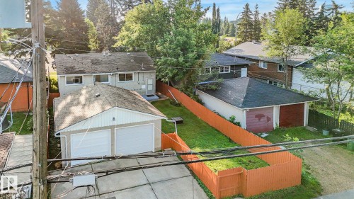 Two detached garages with overhead doors and sloped roofs - 6112 105A Street Nw, Edmonton, AB - Outdoor With Exterior