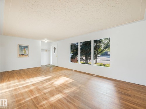 Expansive living area and a multi-pane window - 6112 105A Street Nw, Edmonton, AB - Indoor Photo Showing Living Room