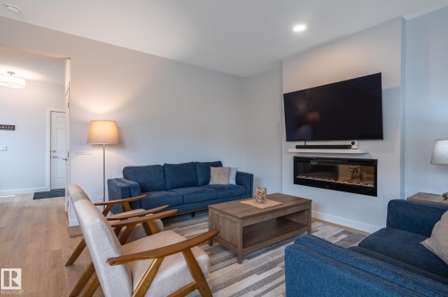 4804 Cawsey Terrace Sw, Edmonton, AB - Indoor Photo Showing Living Room With Fireplace