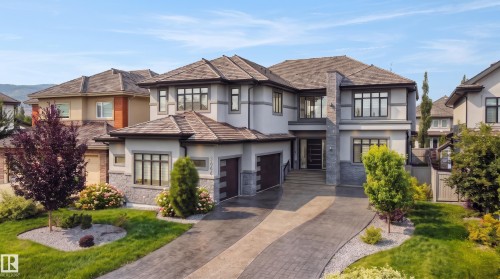 Contemporary exterior with stone facade accents and stucco finish - 3644 Westcliff Way Sw, Edmonton, AB - Outdoor With Facade