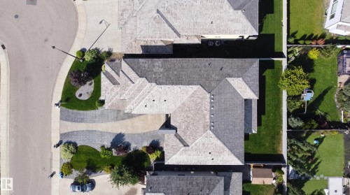 Paver driveway with a patterned design, mature landscaping, and an asphalt shingle roof - 3644 Westcliff Way Sw, Edmonton, AB - Outdoor