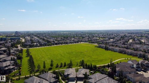Expansive green space bordered by paved pathways and mature trees - 3644 Westcliff Way Sw, Edmonton, AB - Outdoor With View