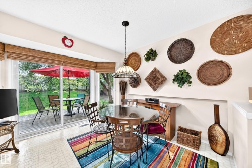Eat-in Kitchen - Easy access to Deck & Yard through the Sliding glass door leading to outdoor deck to enjoy the Morning Sunrise - 350 Pearson Crescent Nw, Edmonton, AB - Indoor Photo Showing Dining Room