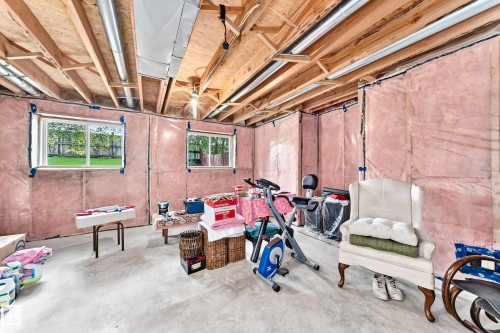 Partially Developed 3rd Level - Large Windows - New Poly over Insulation.  Roughed in Fireplace with Chimney.  Set up for Family Room, Bedroom , Bathroom, and Laundry Room - 350 Pearson Crescent Nw, Edmonton, AB - Indoor Photo Showing Basement
