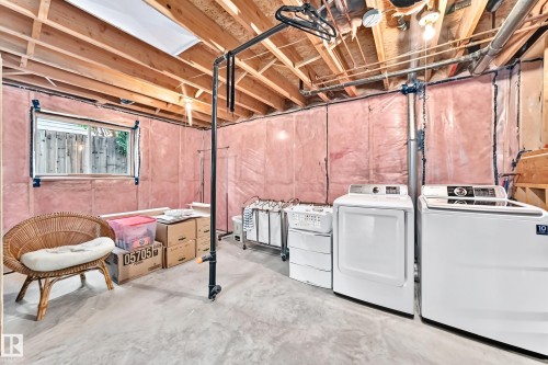 Large Windows - One in Bedroom Area and TWO in Family Room Area overlooking Back Yard - 350 Pearson Crescent Nw, Edmonton, AB - Indoor Photo Showing Laundry Room