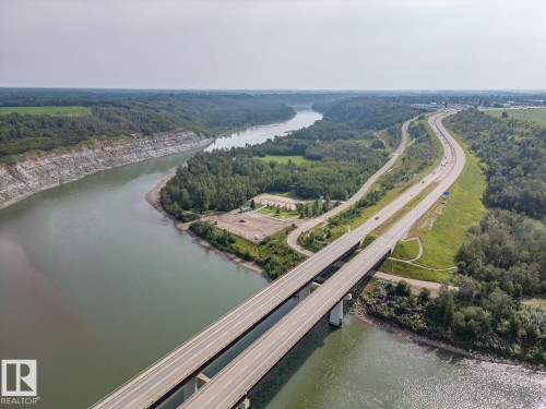 Riverine landscape with an expansive river and adjacent multi-lane highway - 97 Astoria Point(E), Devon, AB -  With View