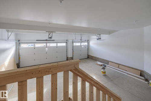 Triple Car Heated Garage with side door entry. - 28 Harley Way, Spruce Grove, AB - Indoor Photo Showing Garage