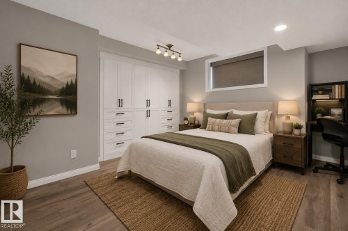 Primary Bedroom Suite with Custom White Built-In Cabinetry, Warm Wood-Finish Flooring, Recessed Ceiling Lighting, Dual Nightstands with Attached Lamps, and Neutral Palette with Layered Bedding - 229 Hillcrest Crest, Sherwood Park, AB - Indoor Photo Showing Bedroom