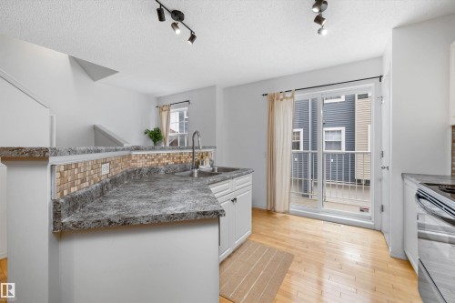 #83 8304 11 Av Sw, Edmonton, AB - Indoor Photo Showing Kitchen With Double Sink