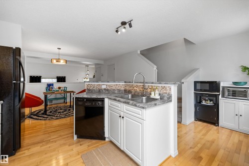 #83 8304 11 Av Sw, Edmonton, AB - Indoor Photo Showing Kitchen With Double Sink