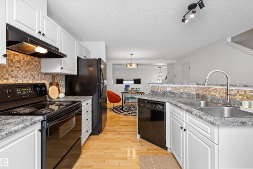 #83 8304 11 Av Sw, Edmonton, AB - Indoor Photo Showing Kitchen With Double Sink