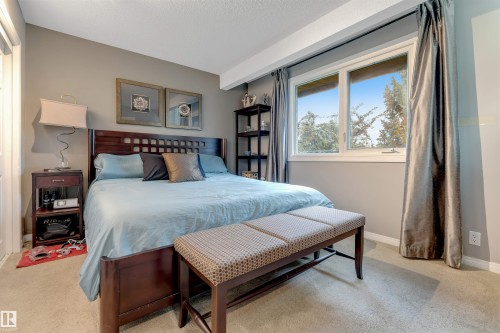 Broadloom carpeting and a large window with direct outdoor scenery - 6008 37 Avenue Nw, Edmonton, AB - Indoor Photo Showing Bedroom