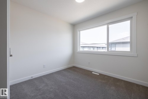 #24 7020 Keswick Cm Sw, Edmonton, AB - Indoor Photo Showing Other Room