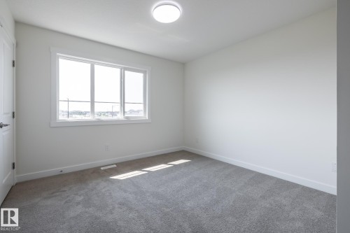 #24 7020 Keswick Cm Sw, Edmonton, AB - Indoor Photo Showing Other Room