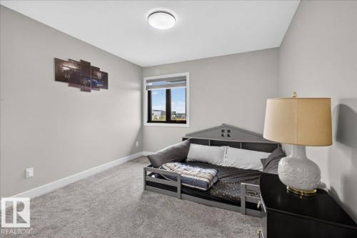 Light gray wall paint, gray carpeting, and a built-in window with black trim - 6813 Knox Loop Sw, Edmonton, AB - Indoor