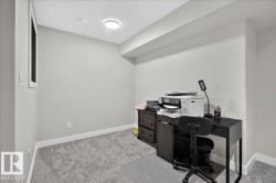 Recessed ceiling light, neutral wall color, white trim, and gray carpet - 