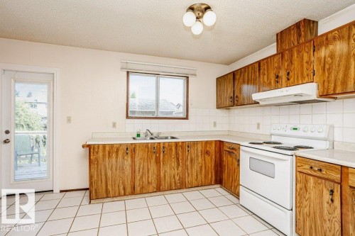 3520 42 Avenue Nw, Edmonton, AB - Indoor Photo Showing Kitchen With Double Sink