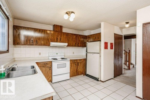 3520 42 Avenue Nw, Edmonton, AB - Indoor Photo Showing Kitchen With Double Sink