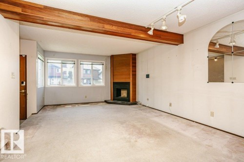 3520 42 Avenue Nw, Edmonton, AB - Indoor Photo Showing Other Room With Fireplace