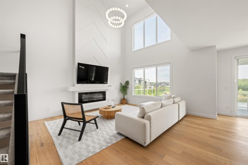 3415 Chickadee Drive Nw, Edmonton, AB - Indoor Photo Showing Living Room With Fireplace
