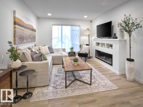 2714 Alces Way Sw, Edmonton, AB - Indoor Photo Showing Living Room With Fireplace
