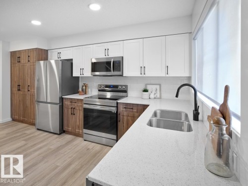 2714 Alces Way Sw, Edmonton, AB - Indoor Photo Showing Kitchen With Double Sink