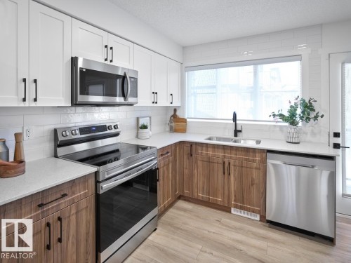 2714 Alces Way Sw, Edmonton, AB - Indoor Photo Showing Kitchen With Double Sink With Upgraded Kitchen