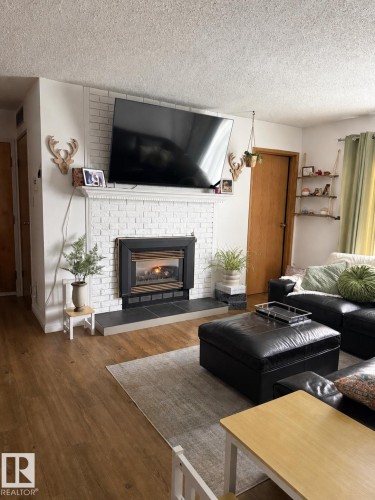 #302 44 Alpine Pl, St. Albert, AB - Indoor Photo Showing Living Room With Fireplace