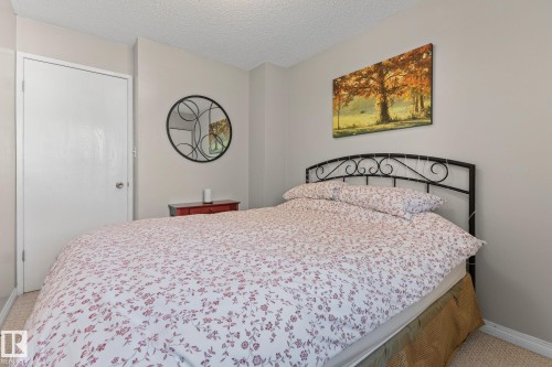 Wall-to-wall carpeting and a textured ceiling - 17132 103 Street Nw, Edmonton, AB 